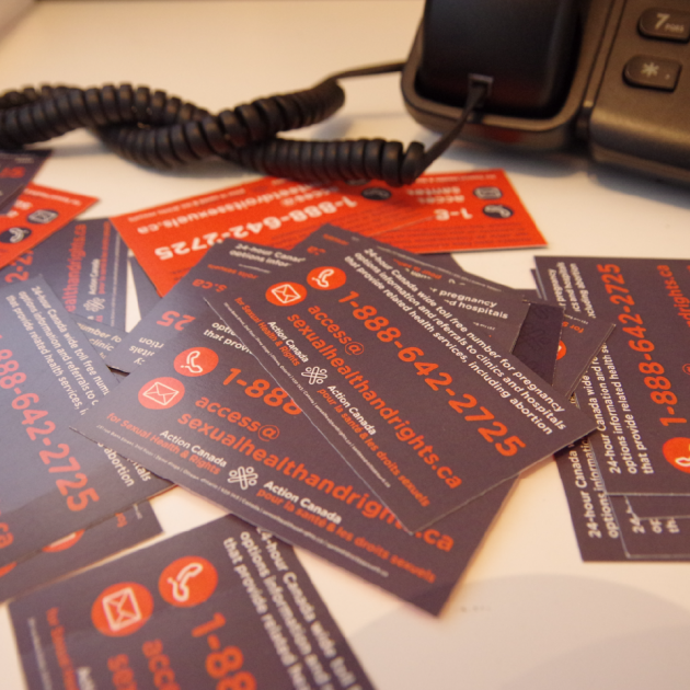 Access Line Business Cards next to a phone