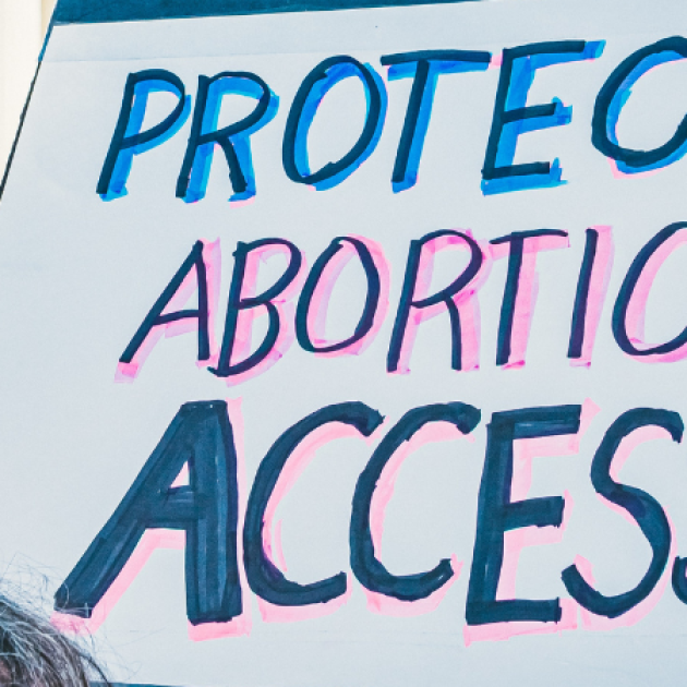 A sign that says "PROTECT ABORTION ACCESS"