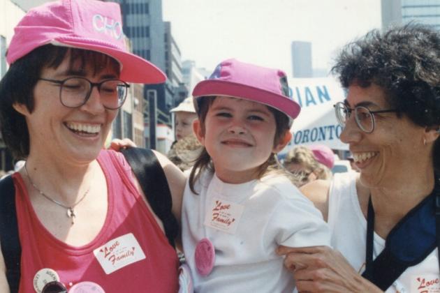 Makeda Zook (centre) with her moms at Toronto Pride in 1992