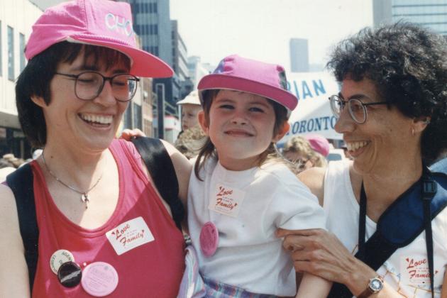 Makeda as a toddler with her mothers at Toronto Pride