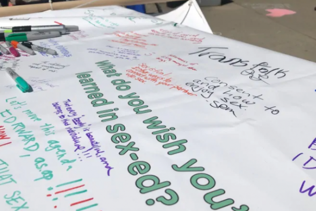 Banner where people wrote what they wish they'd learned in sex-ed