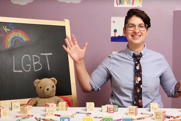 Image of an educator in front of a blackboard that says LGBT