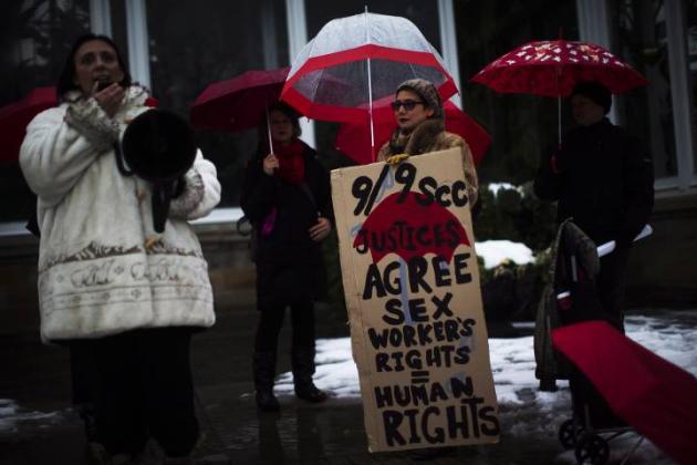 Protestors are seen during rally at Allan Gardens in Toronto. . THE CANADIAN PRESS/Mark Blinch