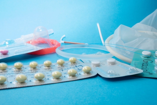 Image of different contraception options sprawled across blue background