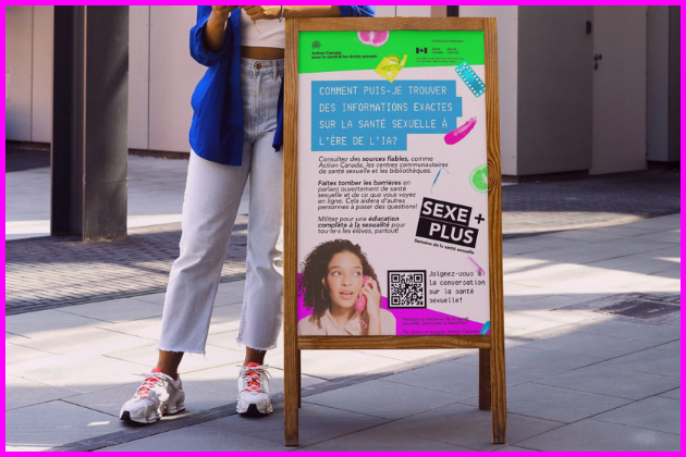 Person standing next to a poster