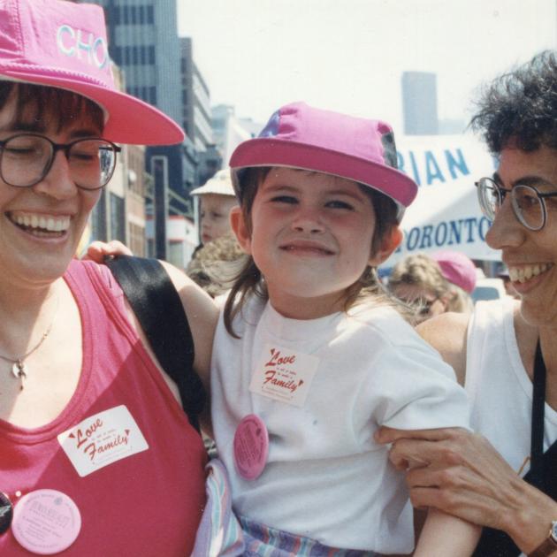 Makeda as a toddler with her mothers at Toronto Pride